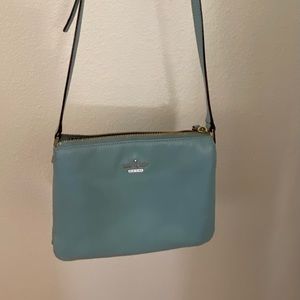 Kate Spade light blue crossbody purse with adjustable buckle strap